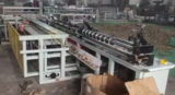 Paper tube rolling and cutting machine